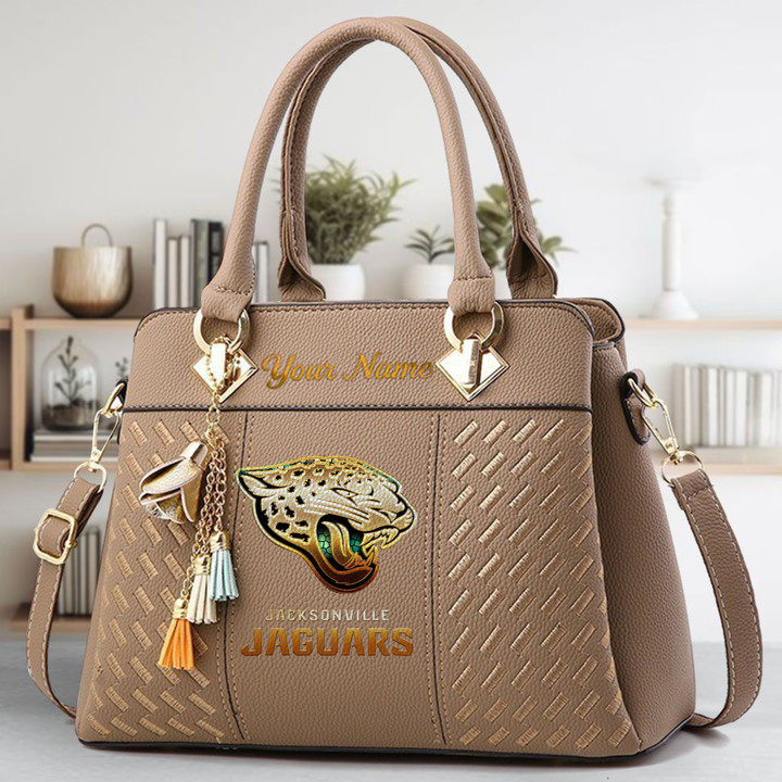 LIMITED EDITION - NEW CUSTOMIZED NFL30 JSJ JACKSONVILLE JAGUARS LUXURY HANDBAG IN MULTIPLE COLORS