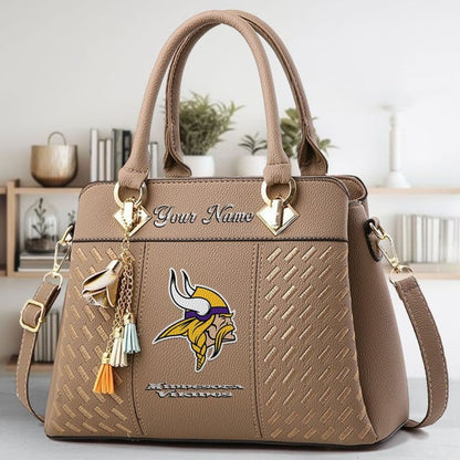LIMITED EDITION - NEW CUSTOMIZED NFL05 MVK MINNESOTA VIKINGS LUXURY HANDBAG IN MULTIPLE COLORS
