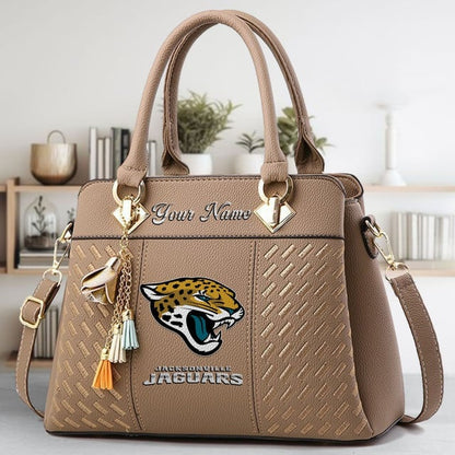 LIMITED EDITION - NEW CUSTOMIZED NFL30 JSJ JACKSONVILLE JAGUARS LUXURY HANDBAG IN MULTIPLE COLORS